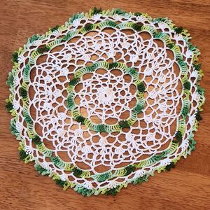 Vintage crocheted doily, green and white circle